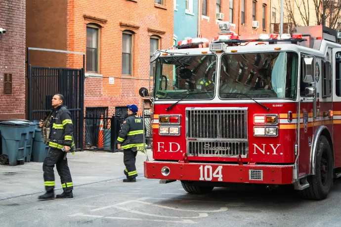 Firefighters and fire truck at a scene